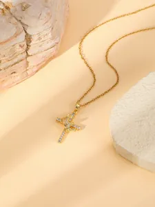 Gold stainless steel cross pendant necklace featuring sparkling rhinestones for women.