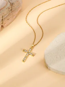 Gold plated stainless steel cross pendant necklace with sparkling cubic zirconia stones for women.