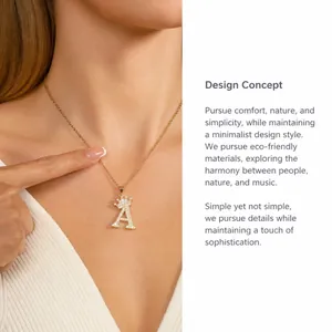 Detailed shot of golden initial A necklace with crown charm and sparkling zircon stones
