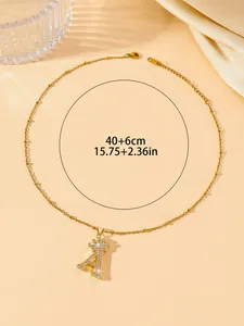 Detail of gold crown letter A necklace with 40+6cm chain length and crystal inlay