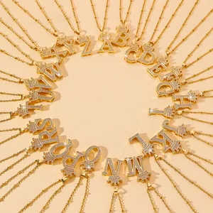 Golden crown initial necklace with sparkling crystals on a bead chain design