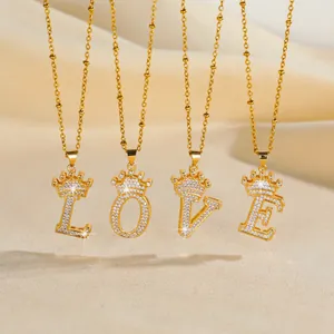 Gold plated LOVE letter necklaces with crown detail and pave set cubic zirconia crystals