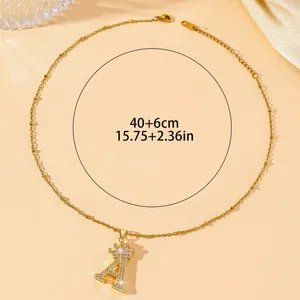 Golden necklace with letter A pendant and crown detail with rhinestones for women