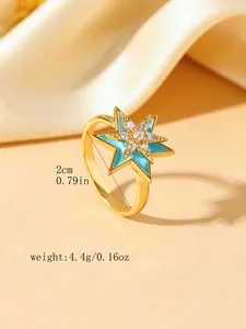 Detail view of gold star ring showing 2cm inner diameter and 4.4g weight specifications