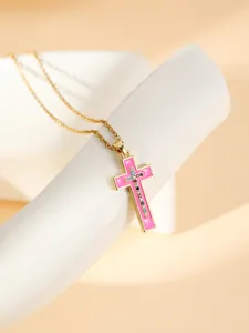 Gold stainless steel cross pendant necklace with pink enamel and colorful cubic zirconia details.