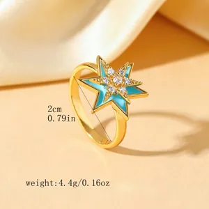 Gold-plated stainless steel star ring with blue enamel and sparkling zircon pavé
