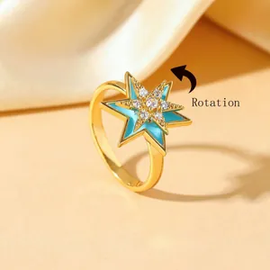 Gold-plated stainless steel star ring with light blue enamel and rotatable zircon top