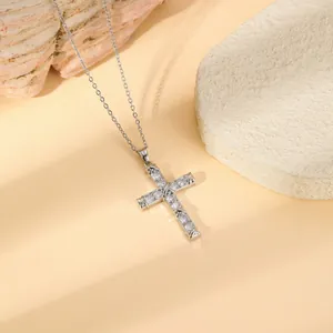 Stainless steel gold plated cross necklace with sparkling zirconia, elegant minimalist fashion jewelry.