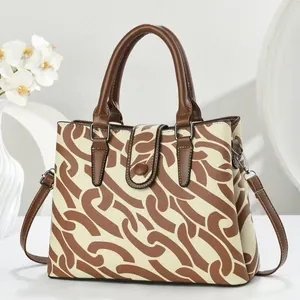 Close-up of printed canvas garden tote bag with premium leather handles and straps