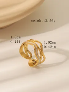 Detail view of gold layered wave ring with white enamel and size measurements