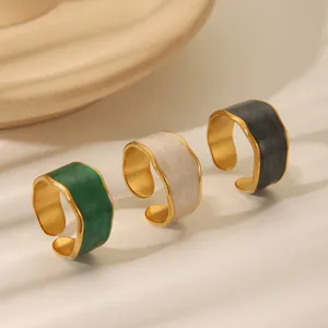 Three retro stainless steel drip oil rings in emerald, cream, and black with irregular edges