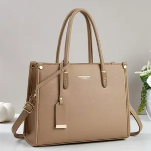 Elegant khaki leather tote bag with large capacity and adjustable shoulder strap