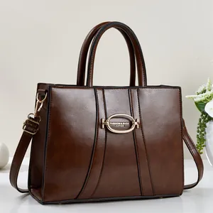 Fashion dark brown leather tote bag with gold buckle and adjustable strap for women