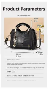 Detail view of black crocodile pattern patent leather handbag with 23x10x18cm dimensions