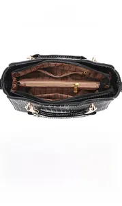 Detail view of large capacity interior with multiple pockets and crocodile texture