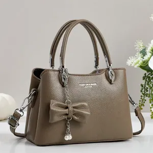 Brown litchi grain PU leather tote bag with elegant bow and pearl pendant decoration