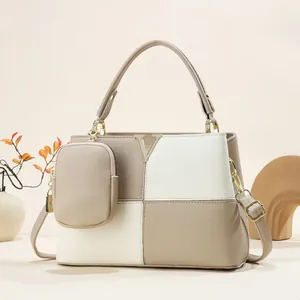 Two-piece minimalist tote bag set in beige and khaki pebbled leather with a gold V logo