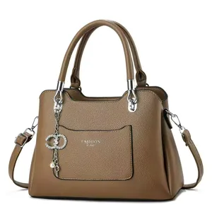 Chic brown leather handbag with Fashion Queen print and luxury pearl charm detail