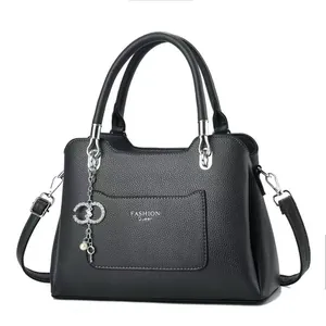 Litchi pattern leather handbag for women with silver pearl charm and shoulder strap