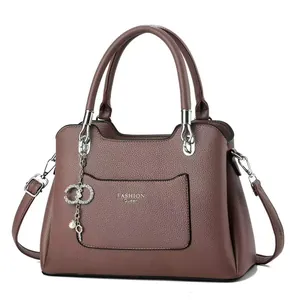 Fashionable mauve large capacity crossbody bag with detachable strap and elegant pendant
