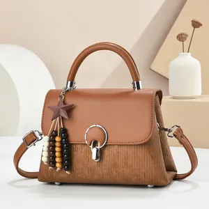 Classic brown flap handbag in faux leather and corduroy with star charm detail