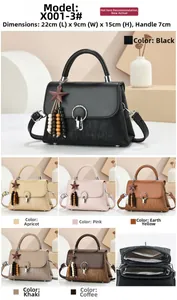 Detail view of stylish square handbag with star charm and internal compartment layout