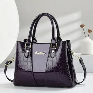 Elegant dark purple patent leather handbag for women featuring stylish crocodile texture