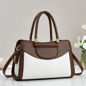 Elegant two-tone brown and white tote bag with FASHION embossing and gold hardware