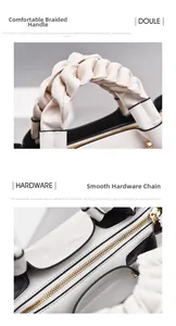 Detail of woven handle and metal zipper on black and white contrast leather handbag