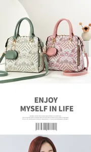 Detail of vintage embroidered handbags with wave patterns and matching charm purses
