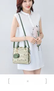 Detail of embroidered vintage style shoulder bag with small coin purse and metal clasp