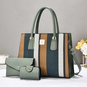 Three-piece handbag set featuring striped woven tote, clutch, and card holder in green