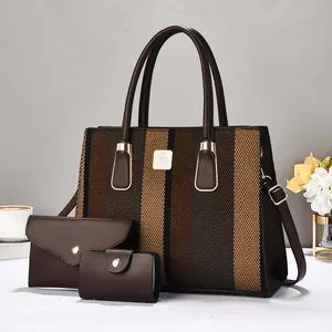 Three-piece women bag set with brown striped tote bag and matching clutch and card holder