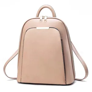 Detail of beige faux leather backpack showing large main compartment and front zip pocket