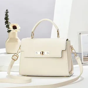Elegant off-white lychee grain crossbody bag with gold clasp and top handle for women