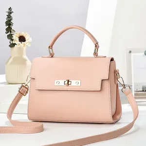 Pink lychee grain structured satchel bag with golden lock and detachable shoulder strap
