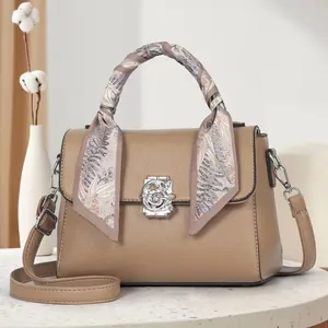 Retro khaki pebbled leather tote bag with scarf-wrapped handle and metal G-lock buckle