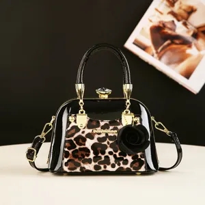 Fashionable leopard print black patent leather shell bag with luxury gem clasp and chain