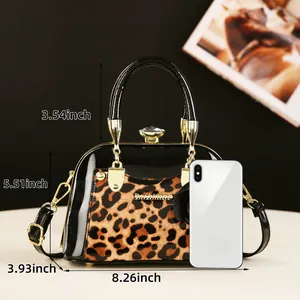 Detailed view of leopard print shell bag with dimensions showing size and gold hardware
