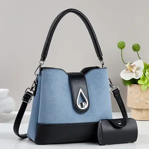 Blue matte fashion handbag with black leather handles and silver water drop metal lock