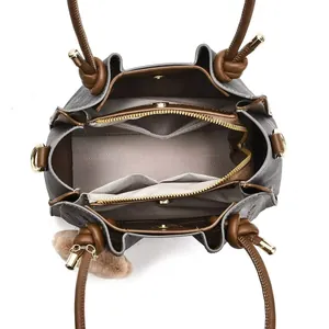 Internal view of a multi-compartment embroidery tote bag with herringbone lining