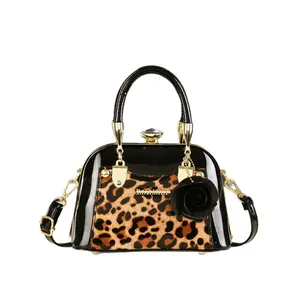 Chic black patent leather leopard print shell bag with gold hardware and rose charm