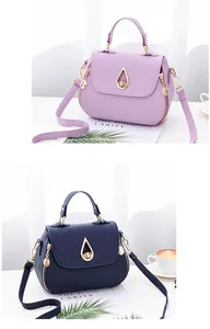 Close-up of quilted PU leather crossbody bags with golden teardrop buckles and handles