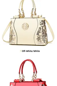 Detail of off-white patent leather bag with intricate floral sequin embroidery and chain
