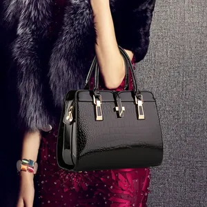 Luxurious black crocodile embossed patent leather tote bag with gold hardware for women