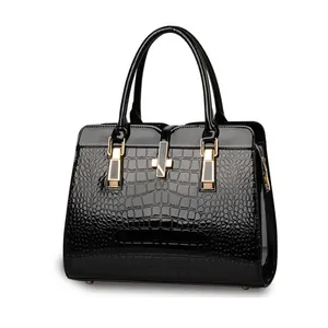 Elegant black crocodile pattern tote bag with glossy patent leather and gold lock hardware