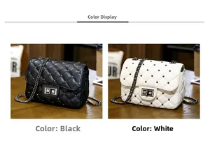 Detail view of black and white quilted crossbody bags with studs and chain straps