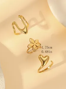 Detail view of 18k gold plated flower ring measuring 1.75cm diameter on beige background