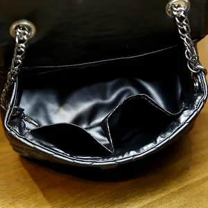 Classic black quilted leather chain bag with silver hardware and dual inner pockets