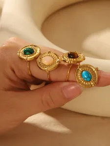 Macro shot of 18k gold plated bohemian rings set featuring colorful turquoise and stones